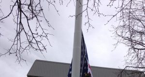 Flag-Raising Ceremony Honors Brookline Slaves Who Fought In Revolutionary War Elmon Hendrickson, Commander of the Brookline American Legion Post 11, raising the U.S. flag.