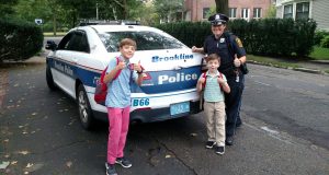 Officer McCabe Gives Two Lucky Students A Ride To School