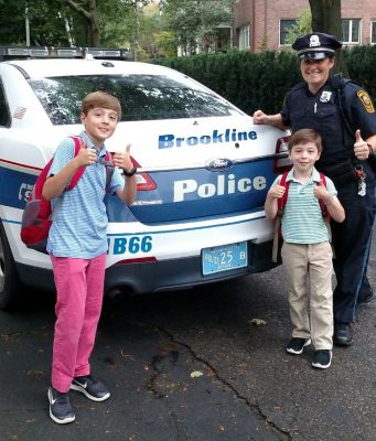 Officer McCabe Gives Two Lucky Students A Ride To School